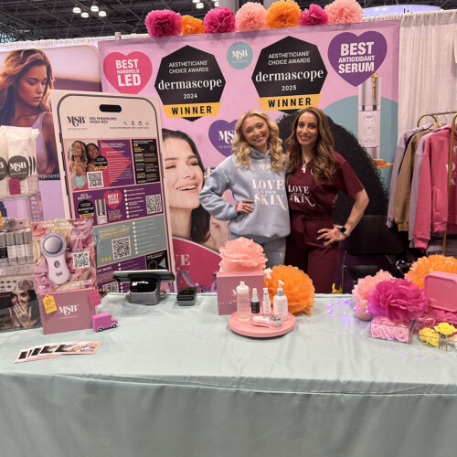 Charli Rissmiller ’25 (left) and her MySkinBuddy supervisor (right) at their conference booth.