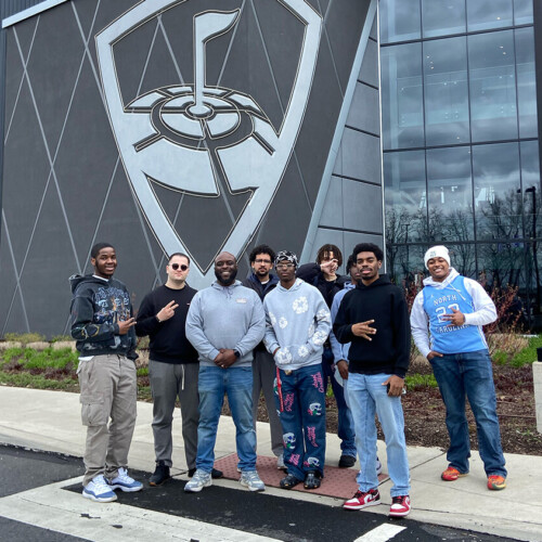 Eugene Garmon and the AIMS students in front of Top Golf.