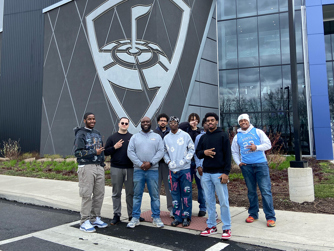 Eugene Garmon and the AIMS students in front of Top Golf.
