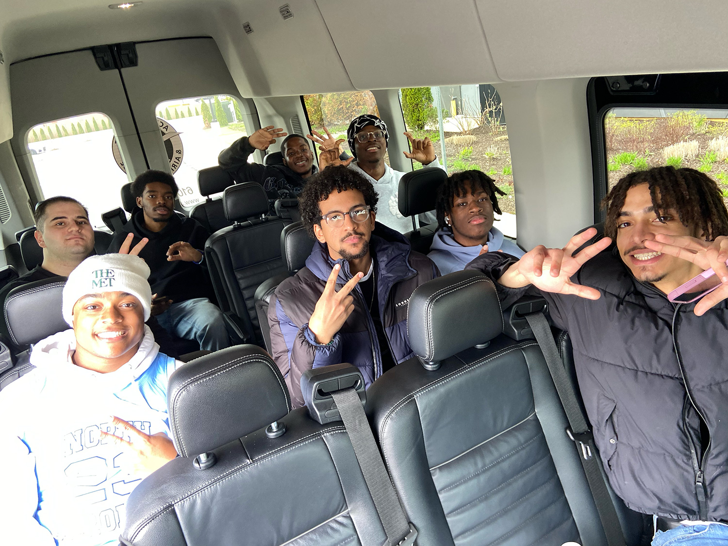 AIMS students on the bus to Top Golf.