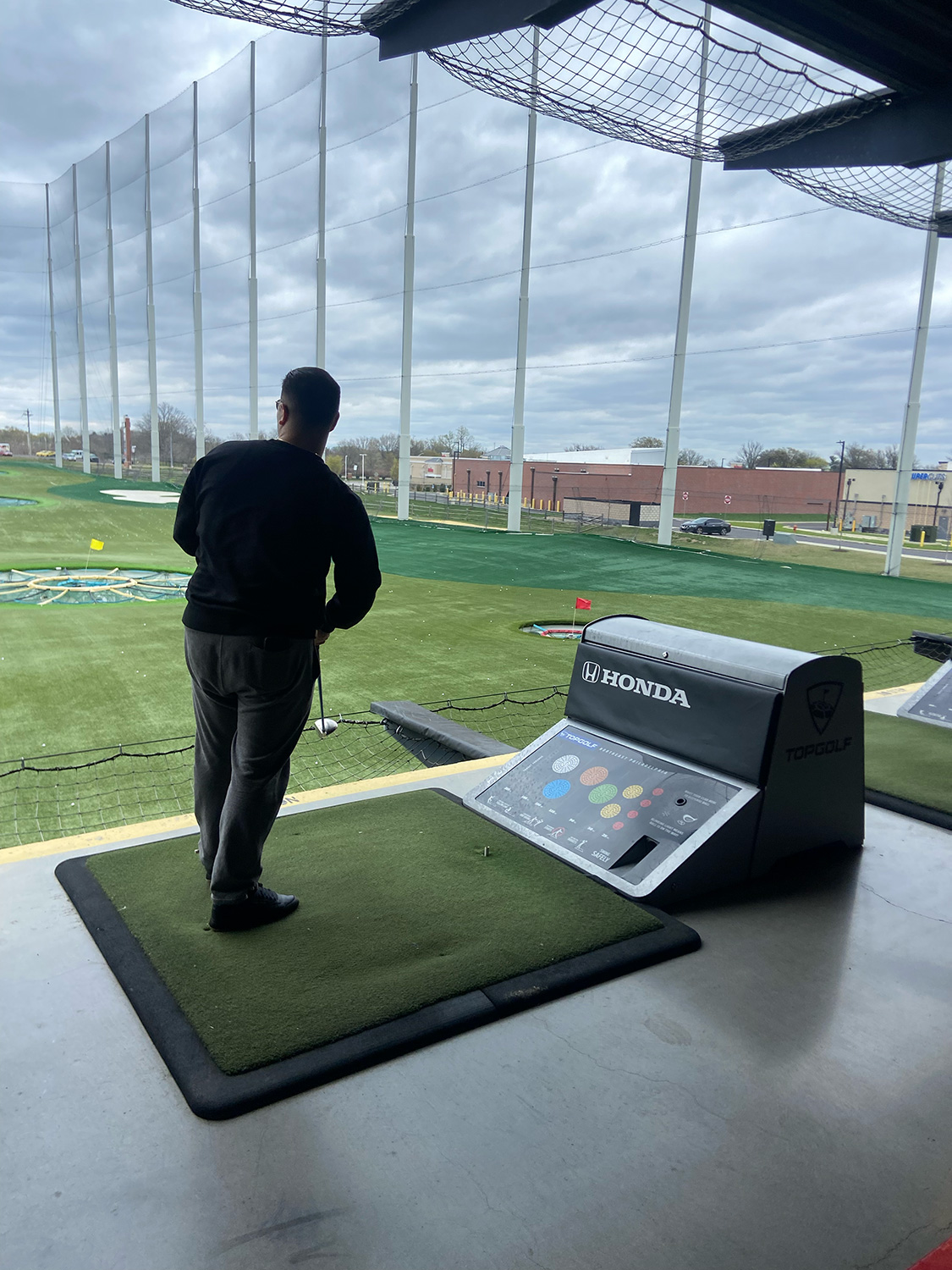 A student practicing their golf swing.