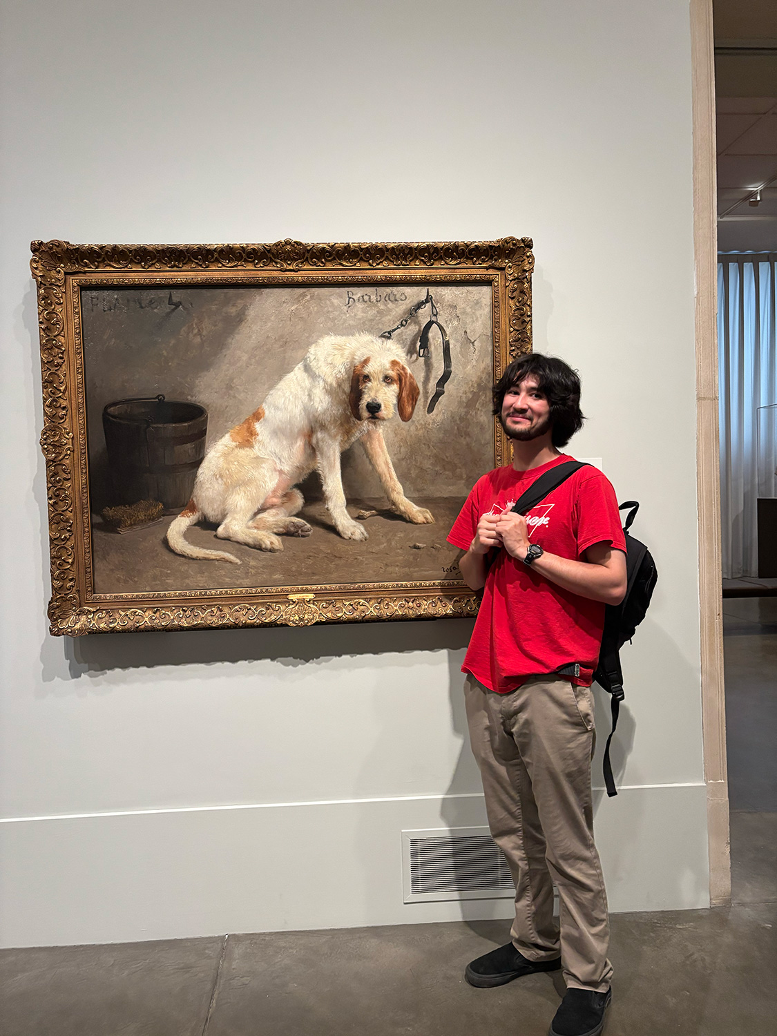 Liam Preyer ’25 with a dog painting.