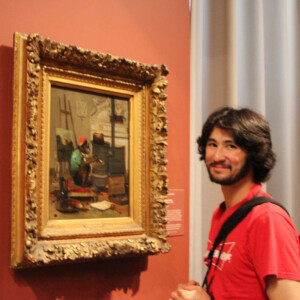 Liam Preyer ’25 with a painting of a monkey.