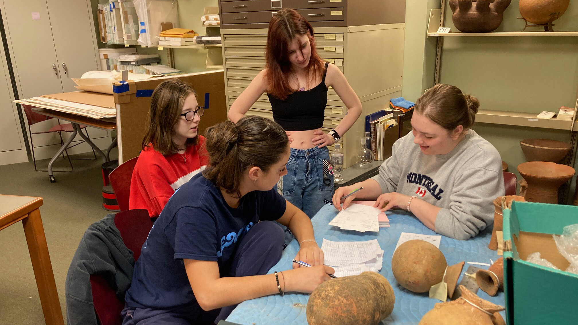 Arcadia students assisting with the university's permanent collection.
