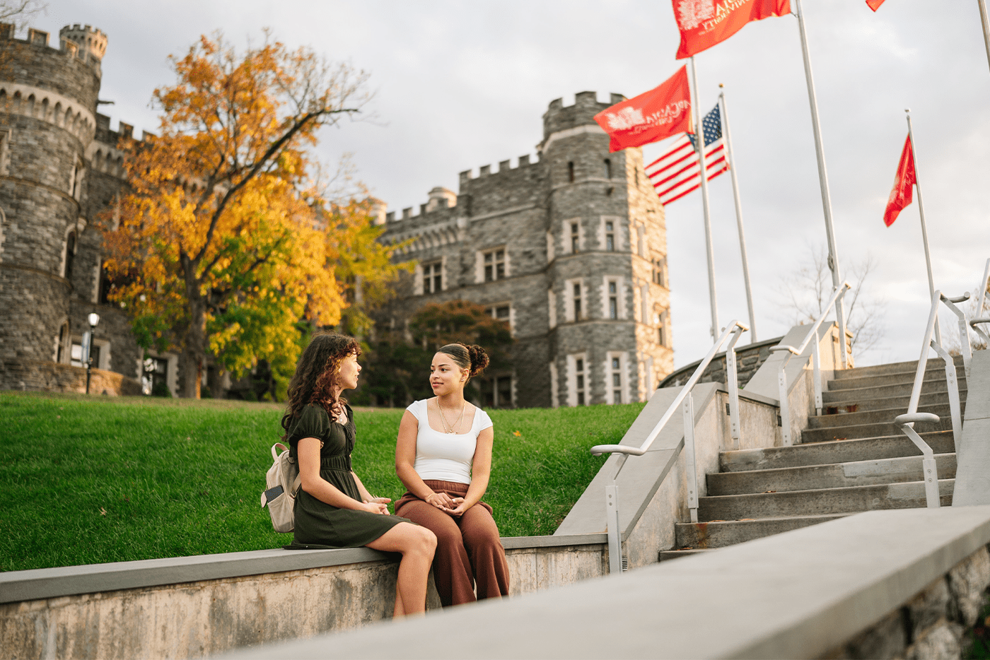 Students enjoying campus in front of Grey Towers Castle.