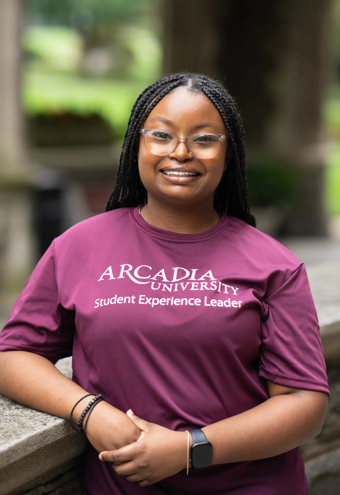 Headshot of Darline Sanon wearing a purple Student Experience Leader t-shirt.