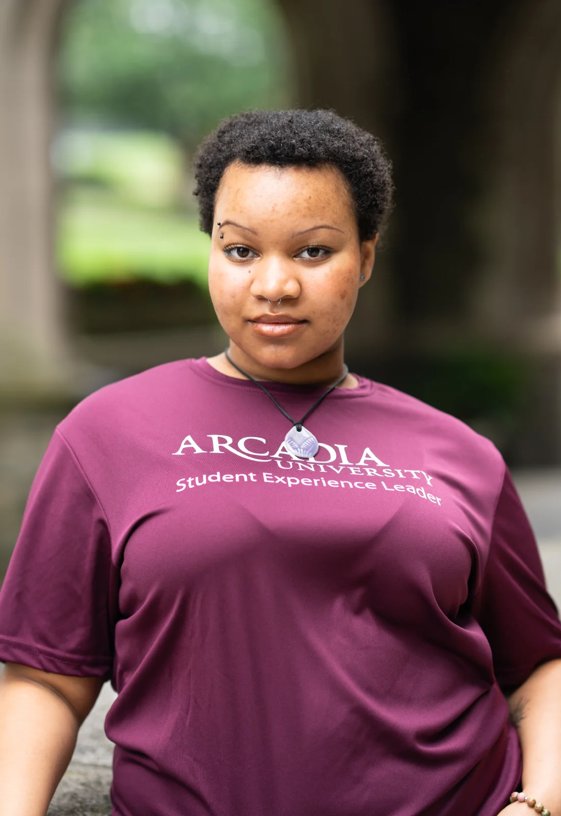 Headshot of Morgan Coates wearing a purple Student Experience Leader t-shirt.