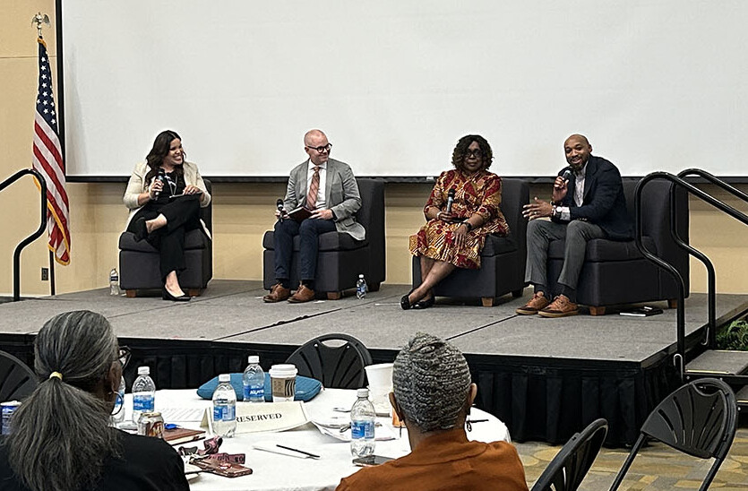 Dr Donavan McCargo (far left) speaking at the symposium.