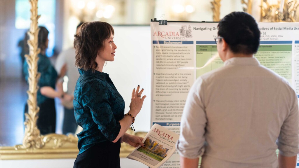 Arcadia University representative speaking to student about online health science graduate certificate
