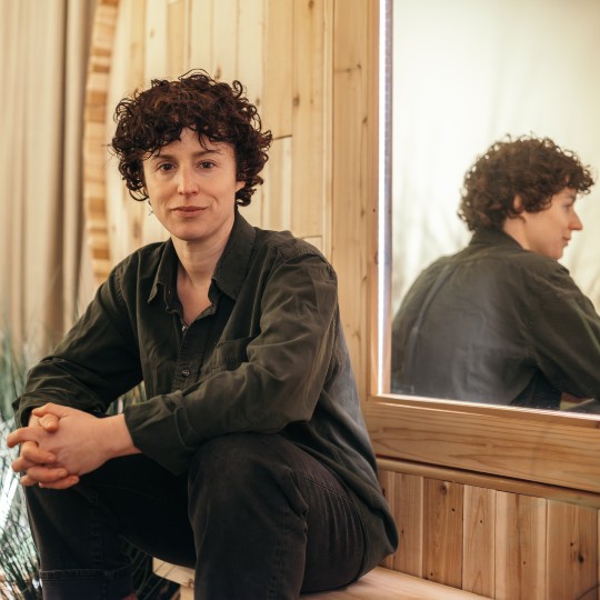 Rebecca Wright sitting in front of mirror