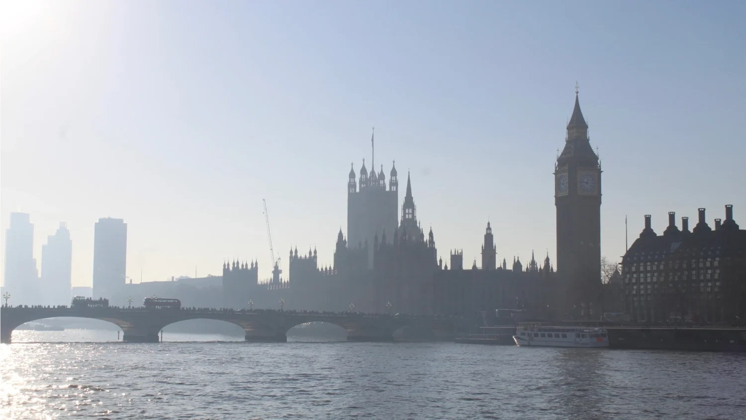 A photo of The Palace of Westminster and the Elizabeth Tower across the River Thames during the day.