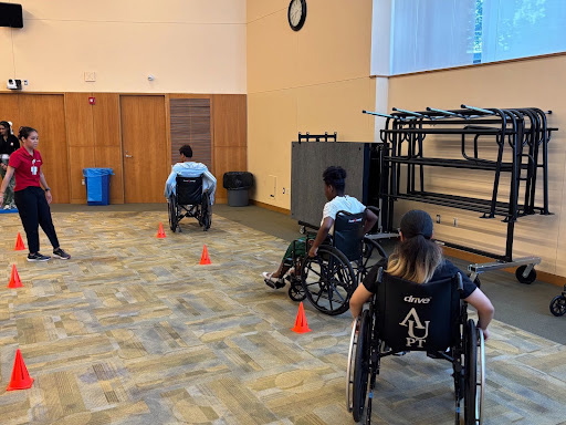 Members of Arcadia's Department of Physical Therapy help students during Health Career Summer Academy