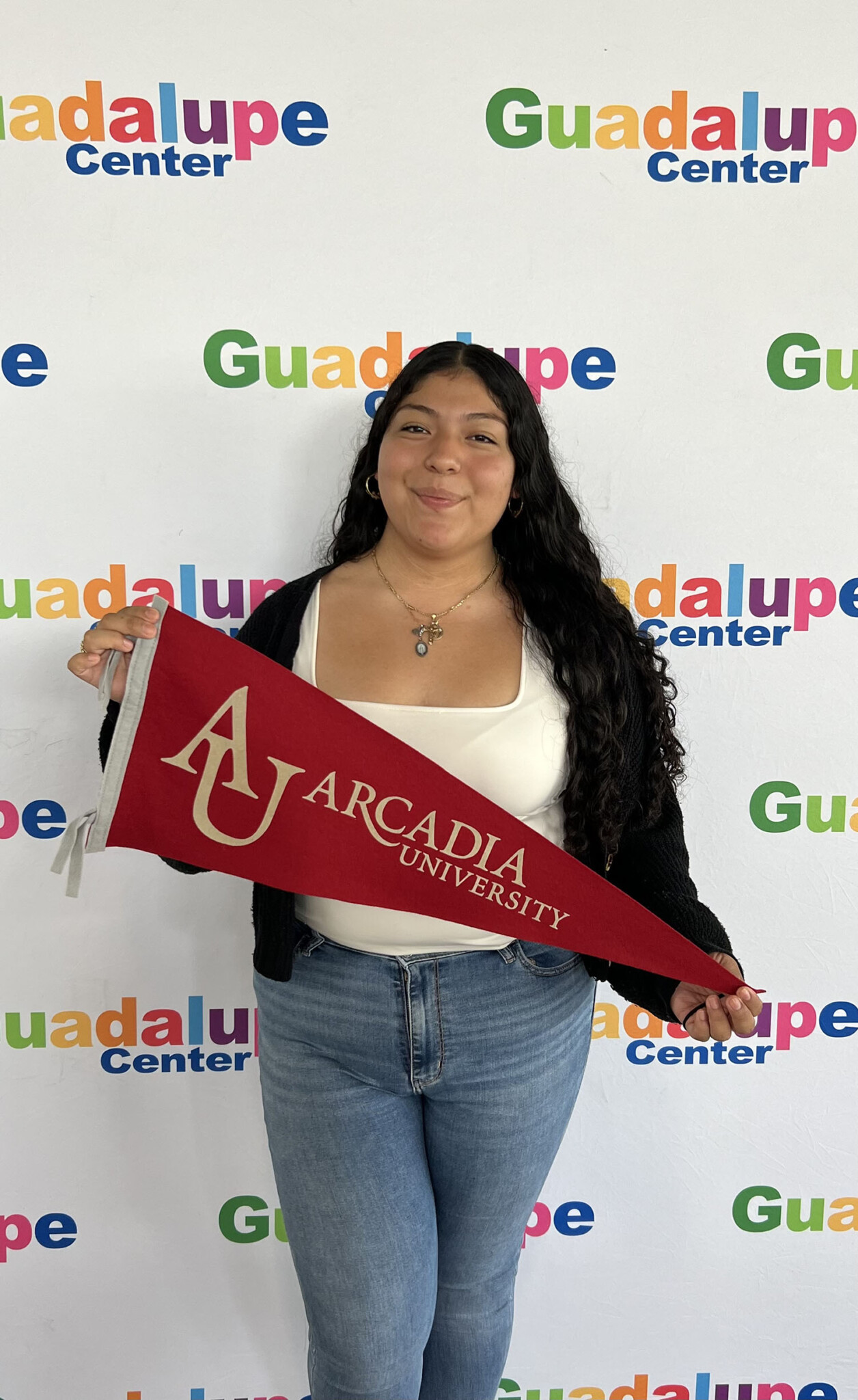 Fatima Frias-Perez ’29 holding an Arcadia pendant.