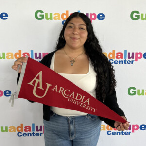 Fatima Frias-Perez ’29 holding an Arcadia pendant.