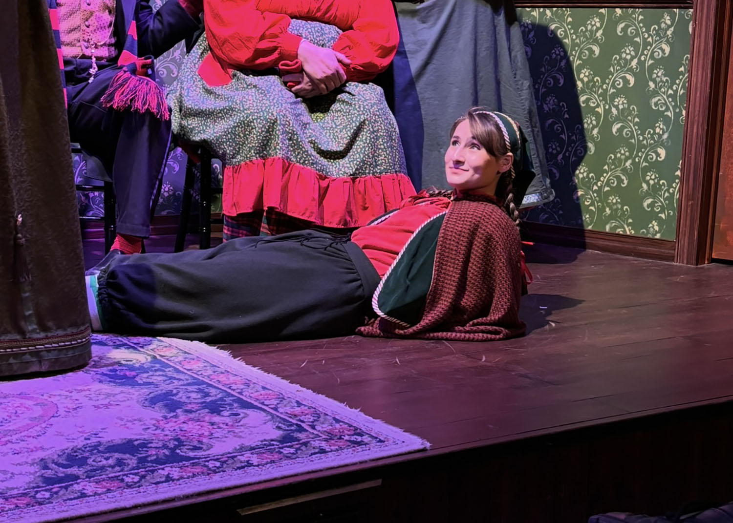 Carly Ruchalski ’29 laying on the stage.