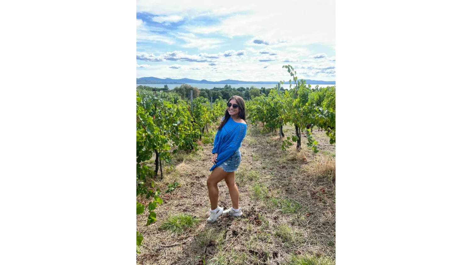 An Arcadia student poses in a field in Perugia, Italy.