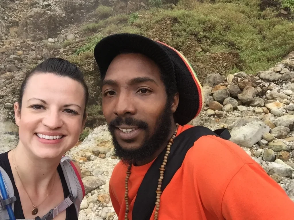 Jessica DeAngelo poses for a selfie with her hiking guide, Martin, while in Dominica.