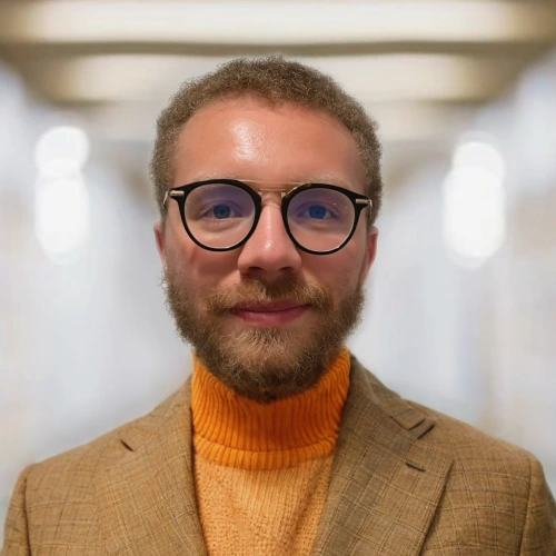 A headshot of Caleb Brown.