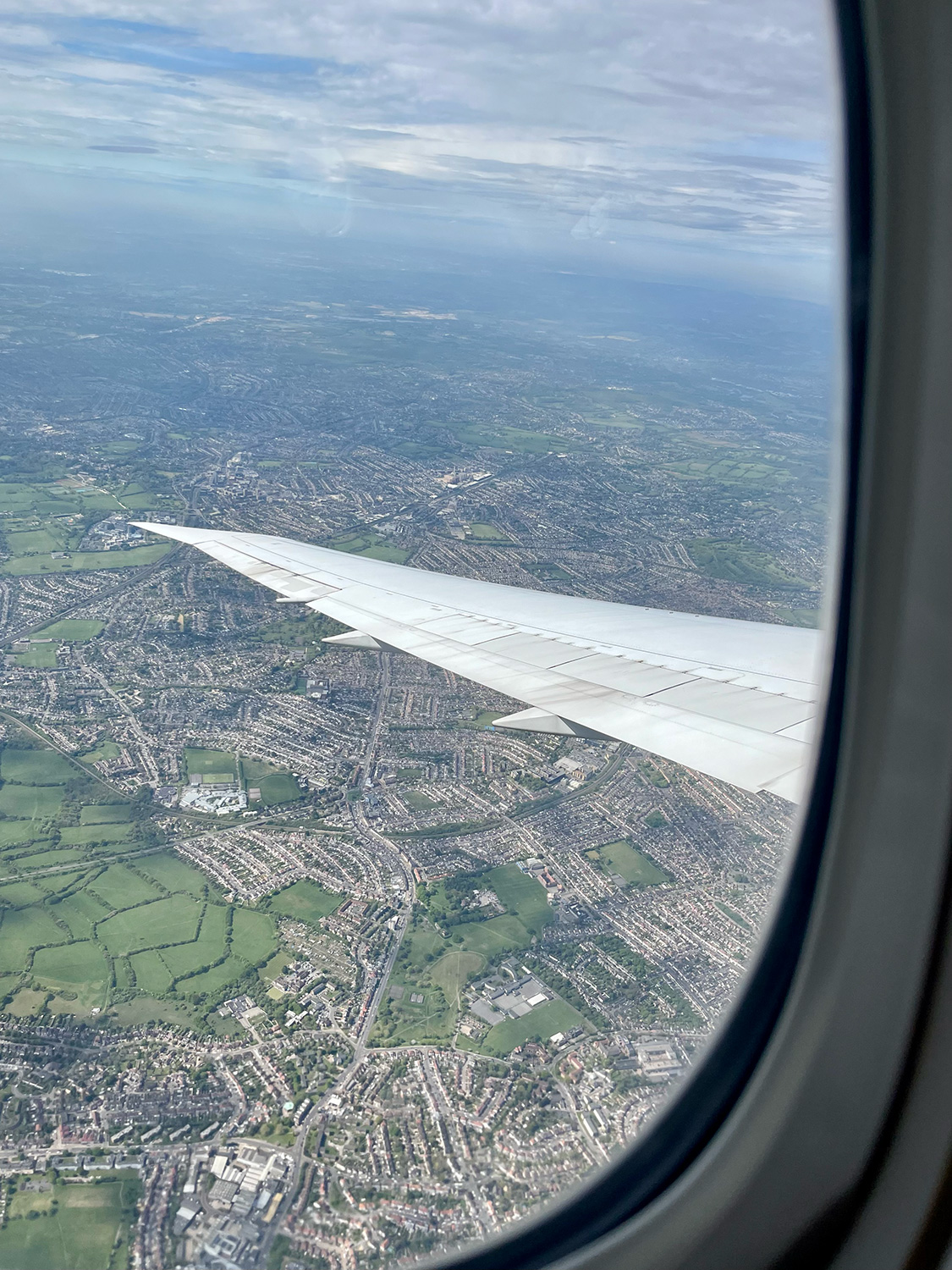 Looking at a plane wing out the window during a flight.