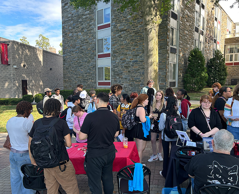 Members of Arcadia community gather on the walk of pride prior to rock the knight