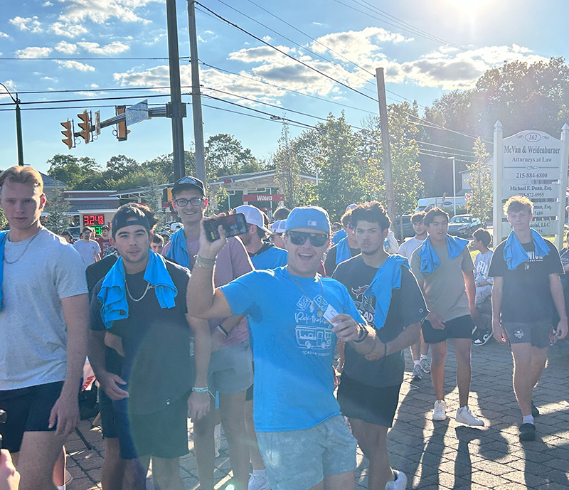 Members of the Arcadia community gather to begin walking to downtown glenside