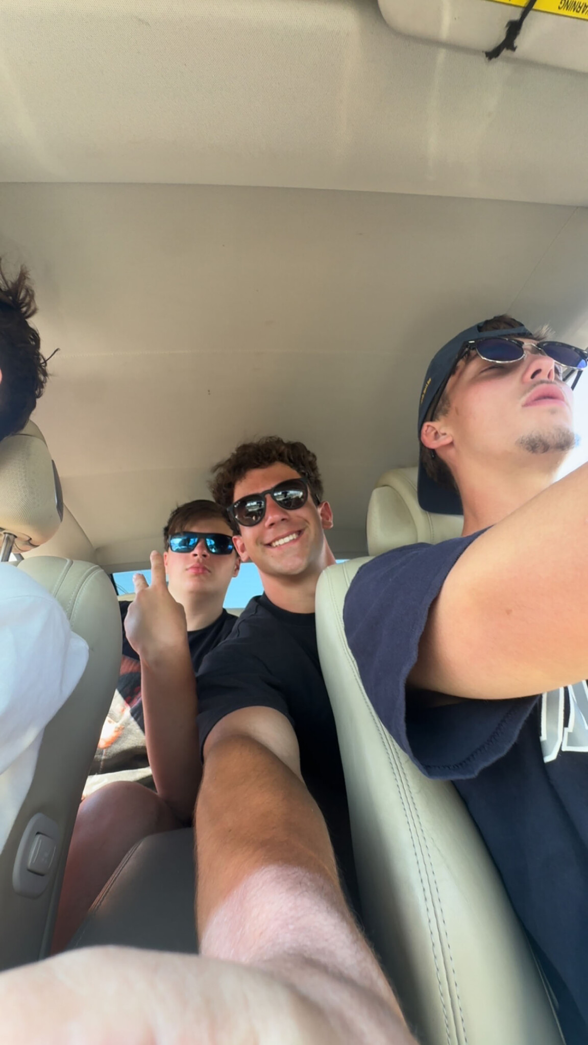 Anthony Barber ’29 in a car with his friends.