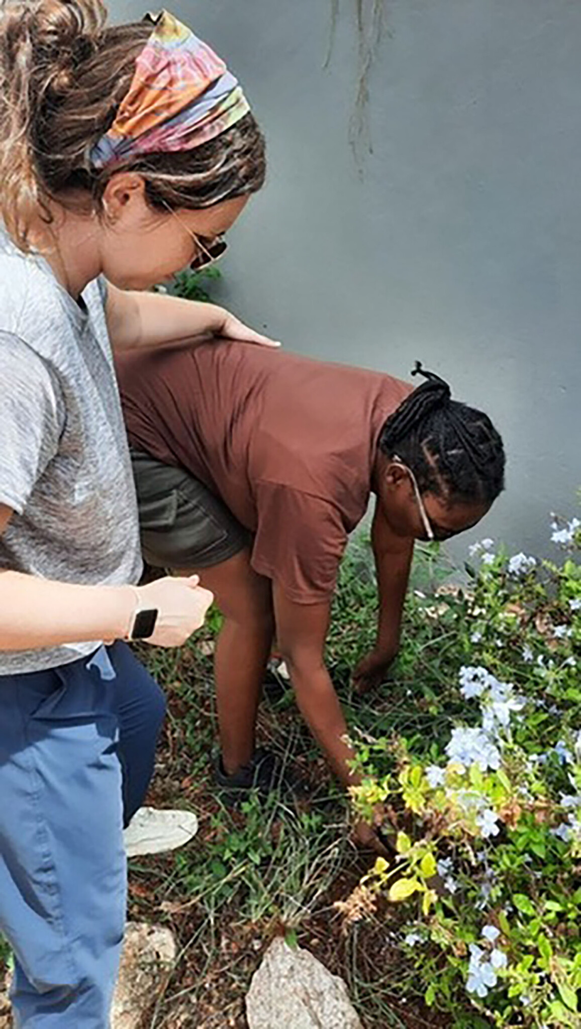 A Doctor of Physical Therapy student assisting a patient in Jamaica.