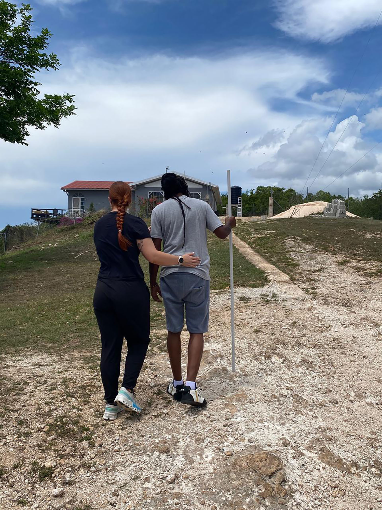 A Doctor of Physical Therapy student assisting a patient in Jamaica.