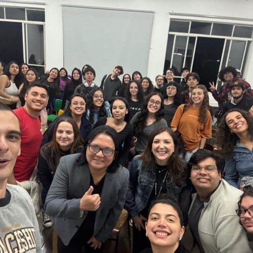 Dr. Augusto Macalalag in the middle of a group of students.