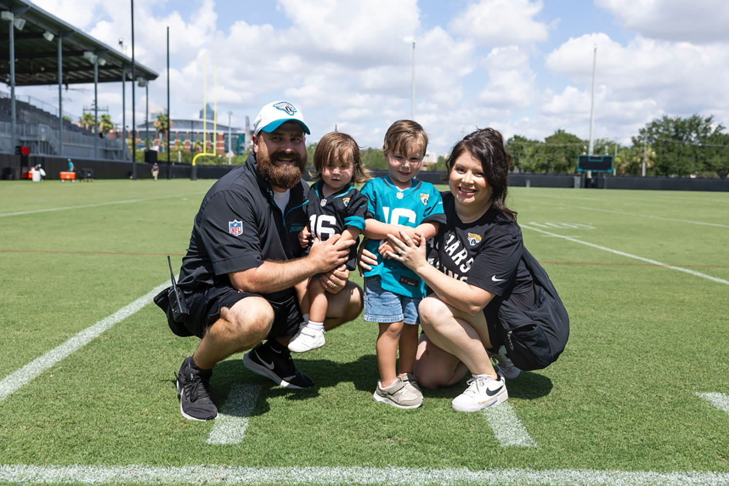 Thomas Milord ’25DPT and his family on a football field.