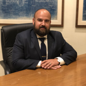 Chuck Puchon ’26EdD at a desk.