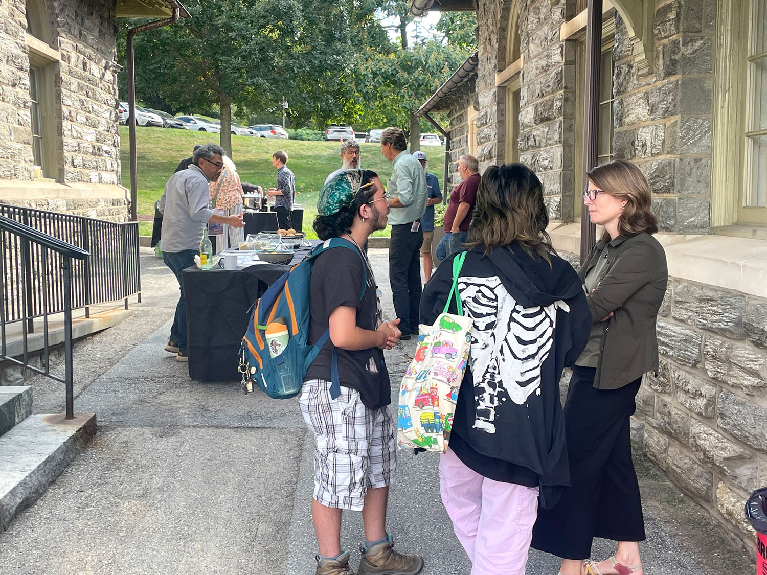 Students, faculty, and staff, talking outside of Spruance Gallery.