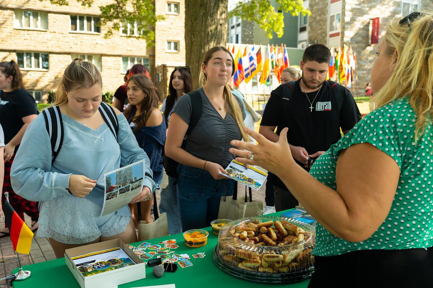 Students talking with Professor McCreery at the Study Abroad fair.