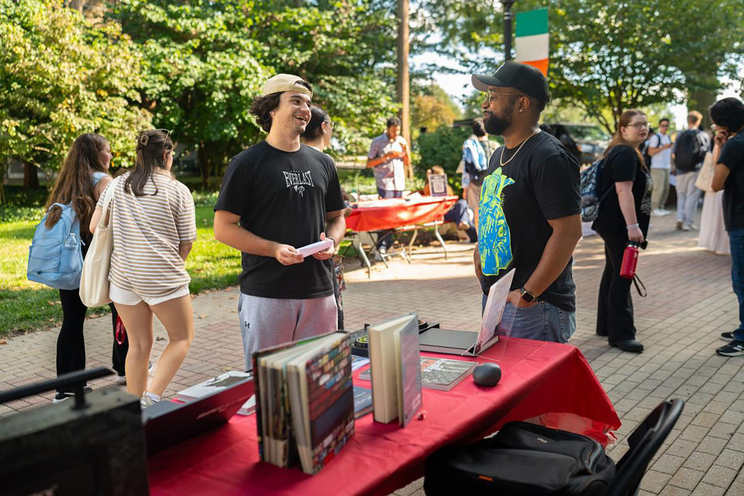 a Students talking with an instructor at the Study Abroad fair.