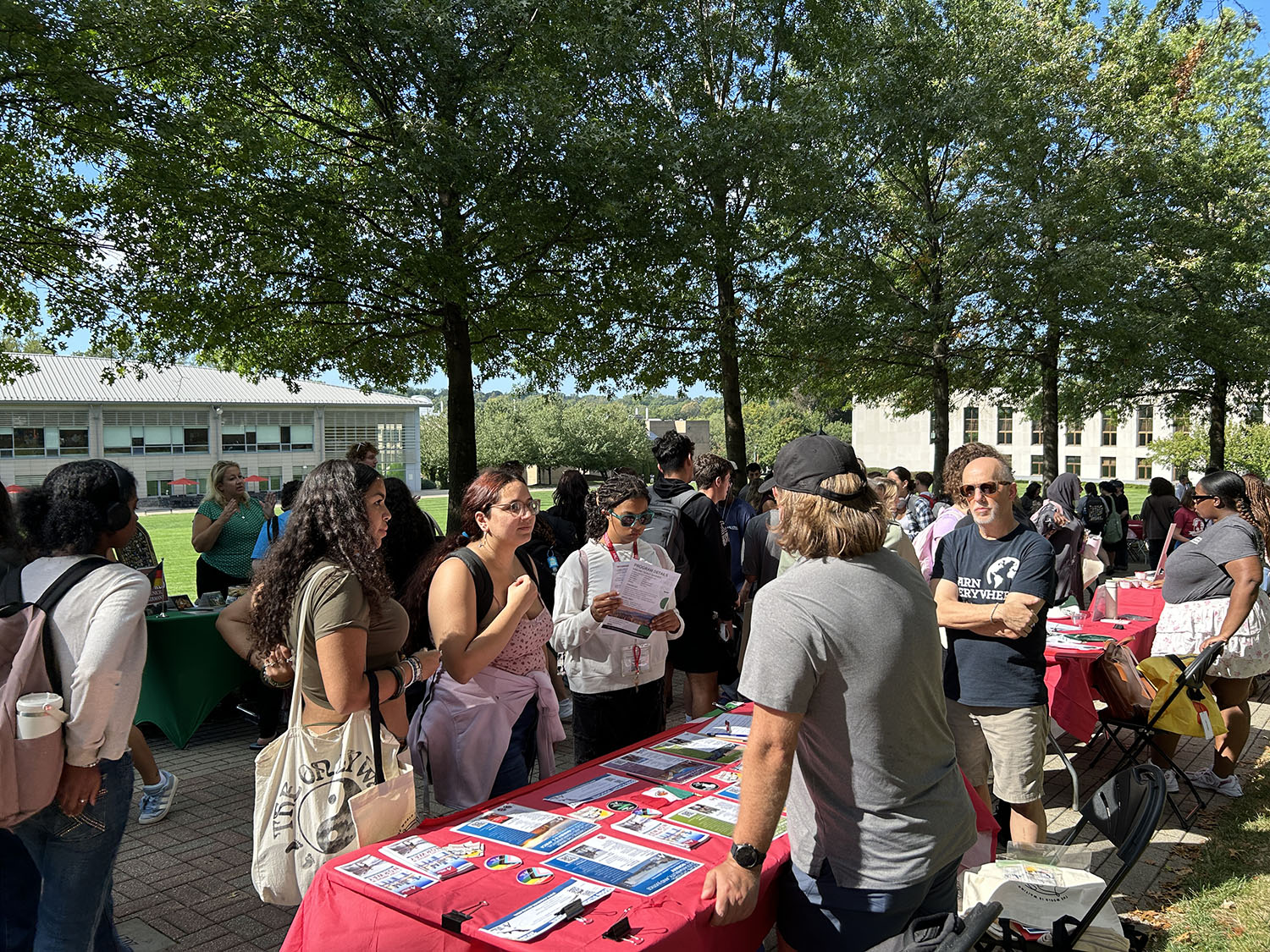 Students talking with instructors at the Study Abroad fair.