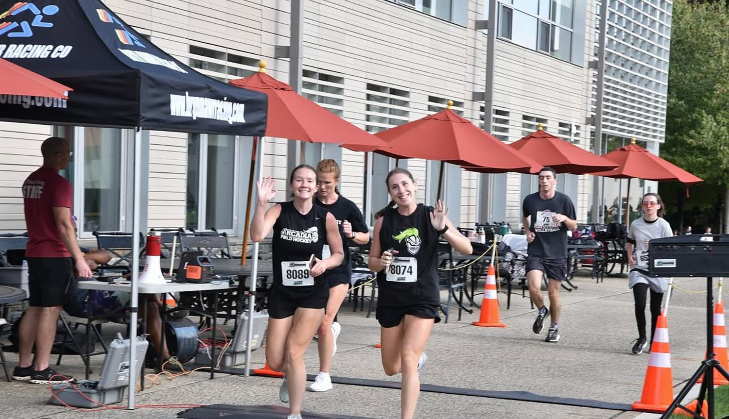 Students crossing the finish line during the THO 5K.