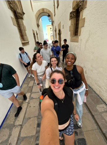 Students taking selfie in streets of Italy