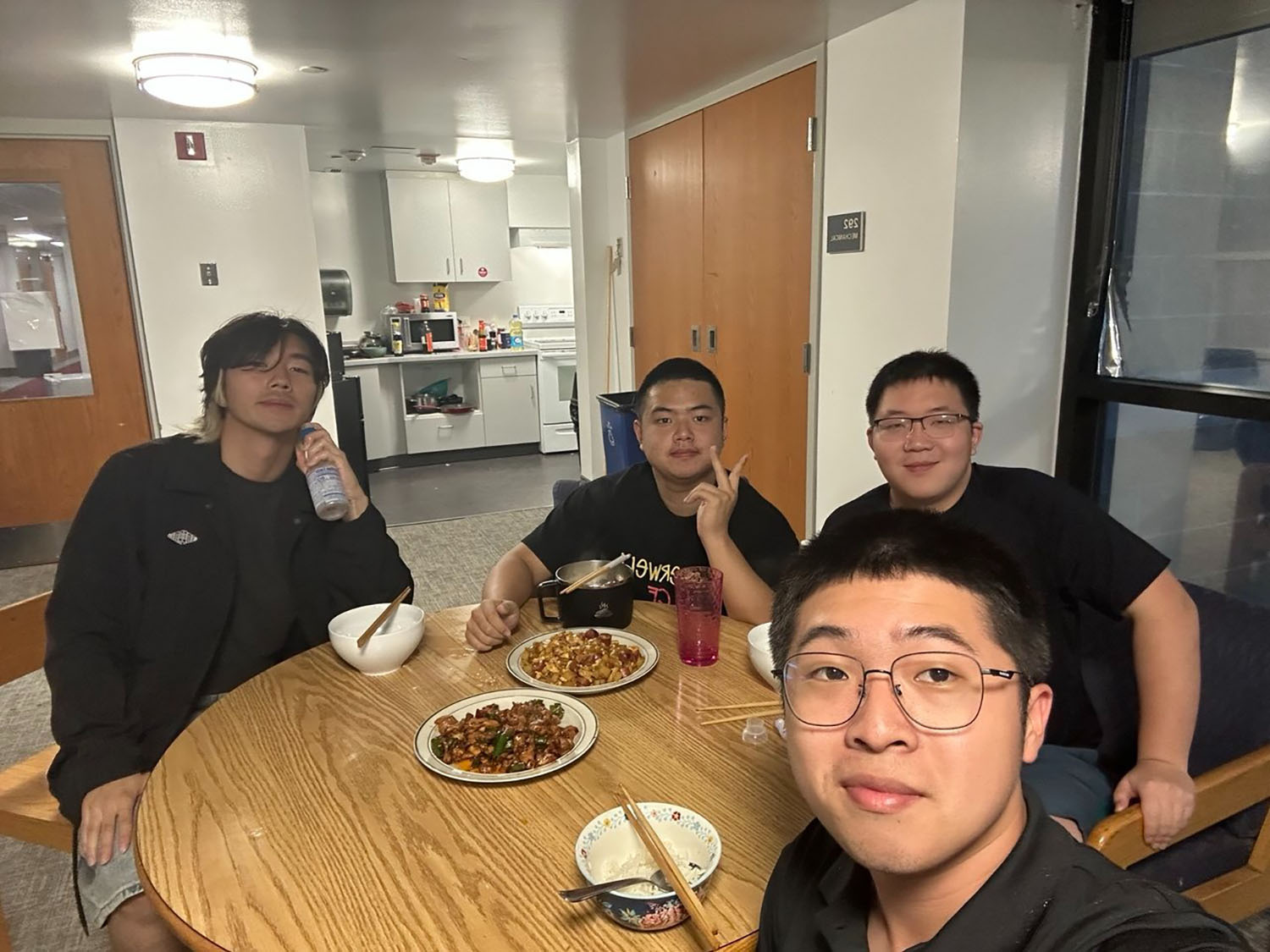 Chayhok Chhor ’27 and his friends eating dinner.