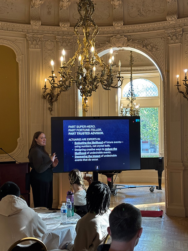 Meredith Brooks of the Casualty Actuarial Society speaks to the students.