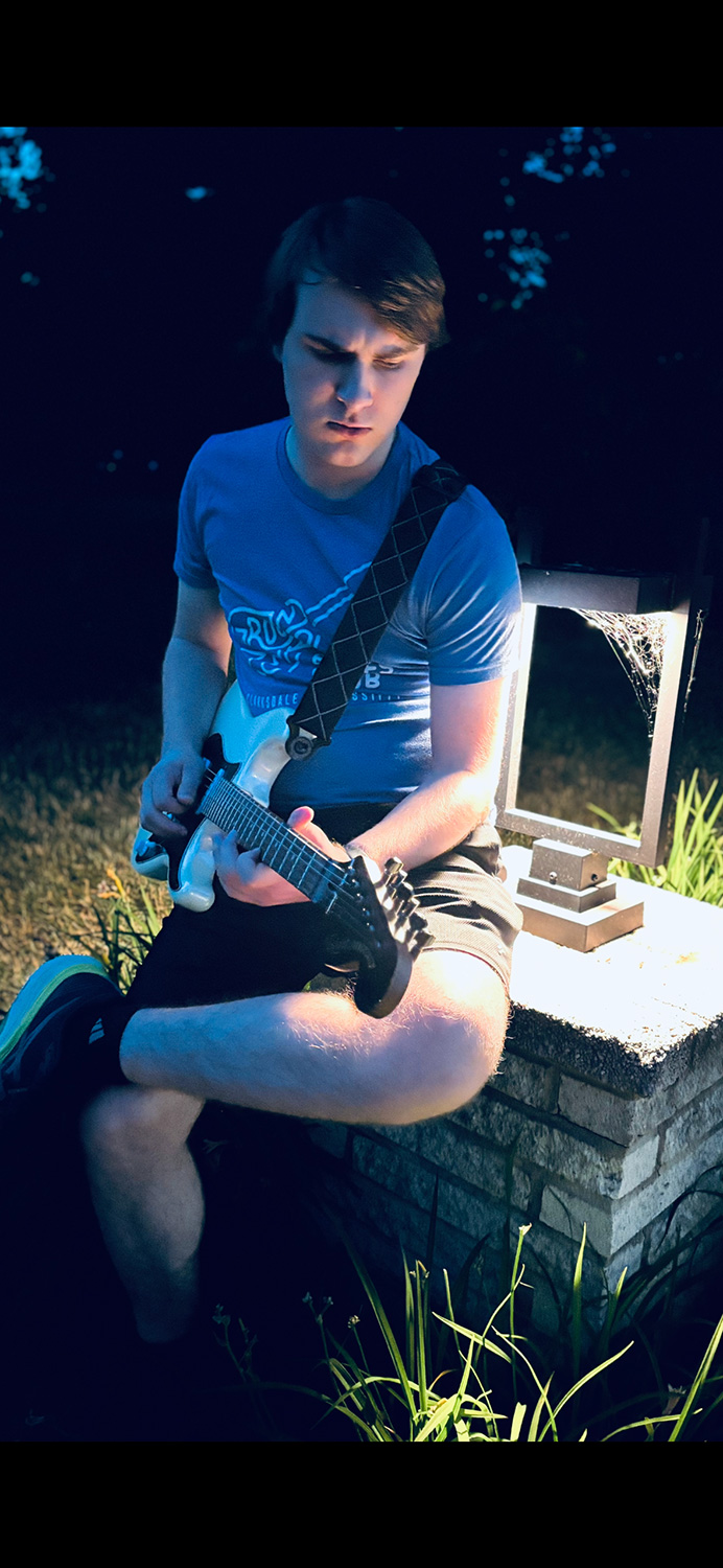Bird Parry ’29 playing guitar.