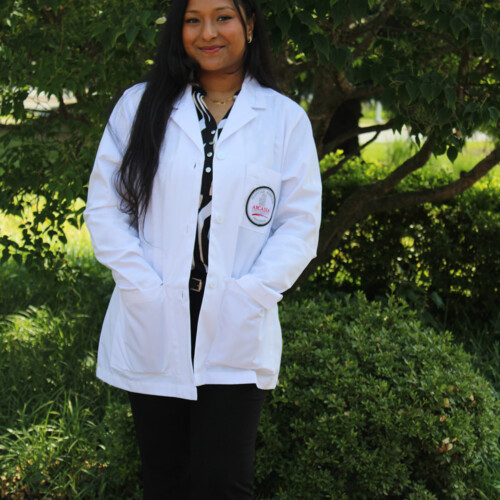 Jenisha Khadka ’27MMS in a PA white coat.