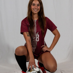 Abby Stephens ’26 in a soccer uniform with a soccer ball.