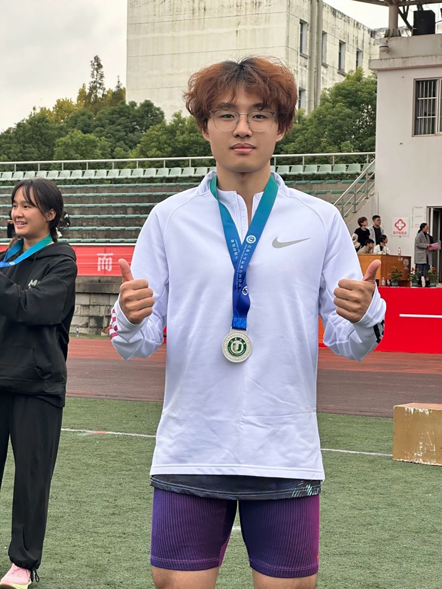 Lei Liu ’27 after winning a medal.