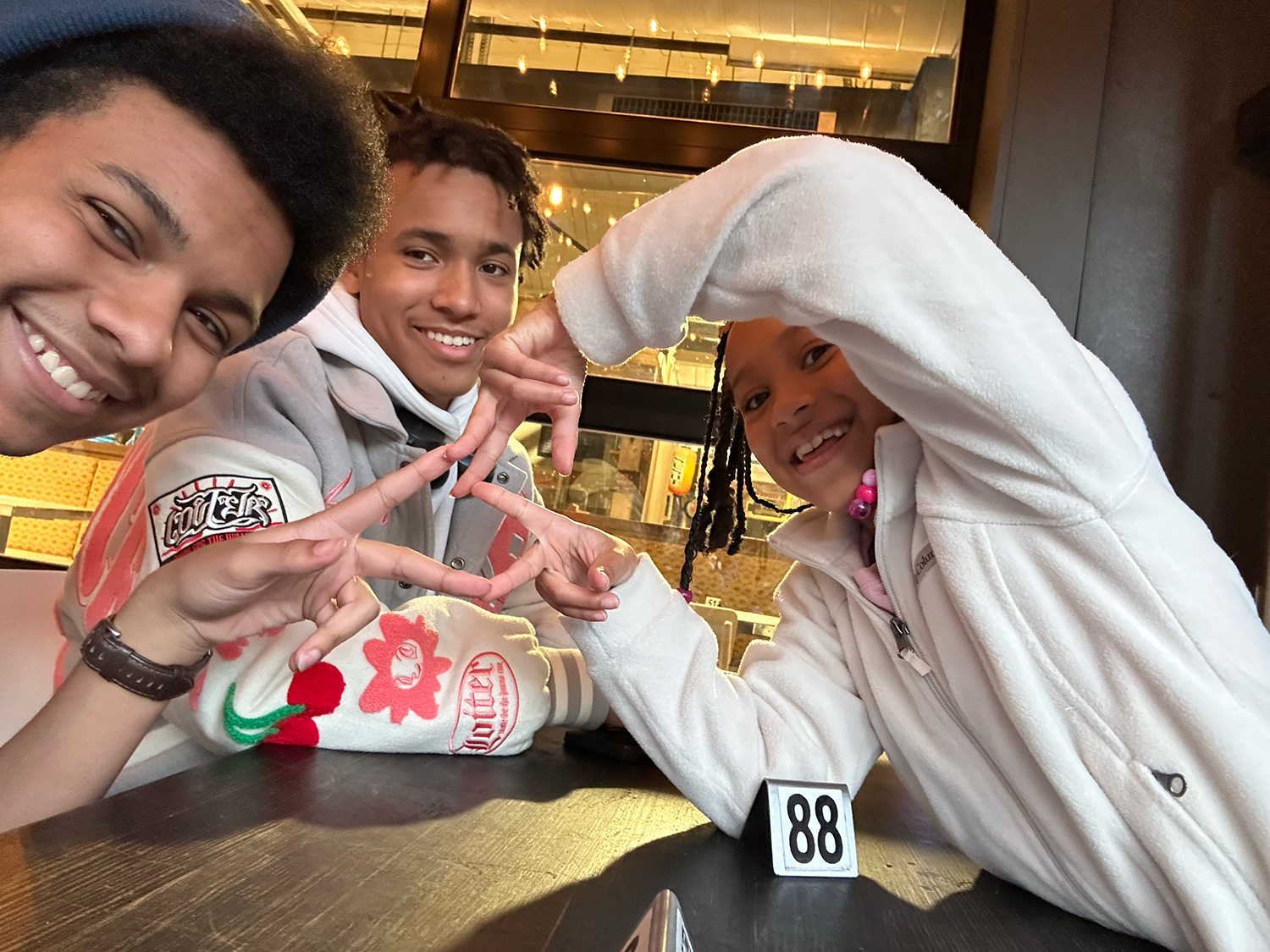 Gideon Liciaga ’28 and friends at a table.