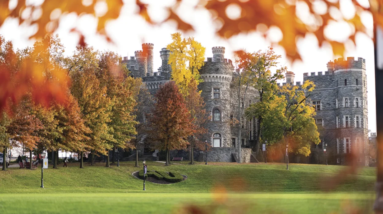 A leafy view of grey towers castle on arcadia’s campus.