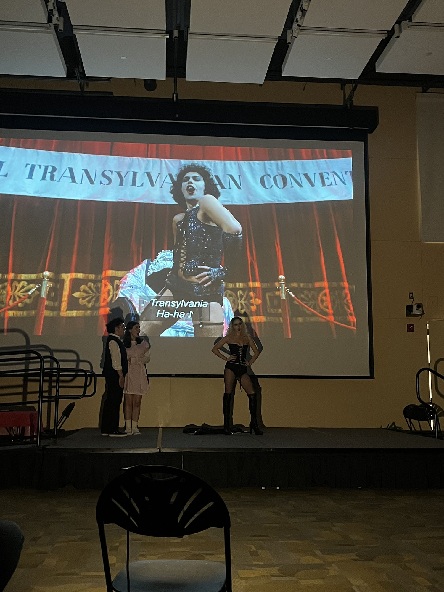 Students dancing on stage for the Rocky Horror Picture Show.
