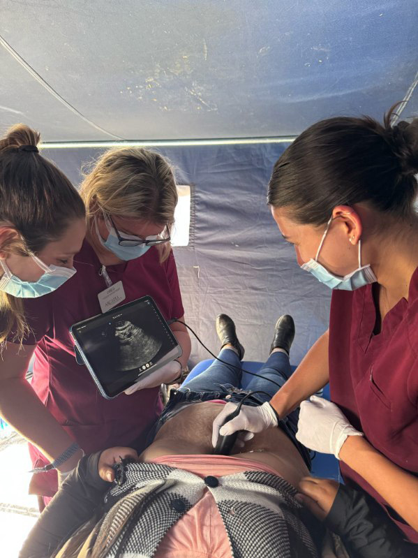 Andrea works with classmates on an ultrasound in Cusco, Peru, May 2025