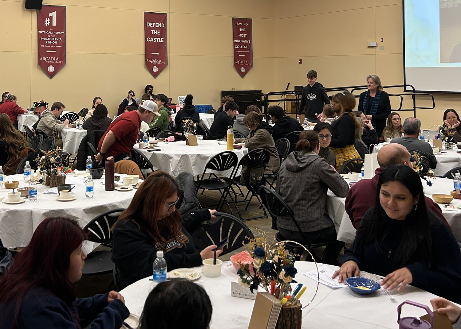 Guests sitting at tables in the Commons Great Room.