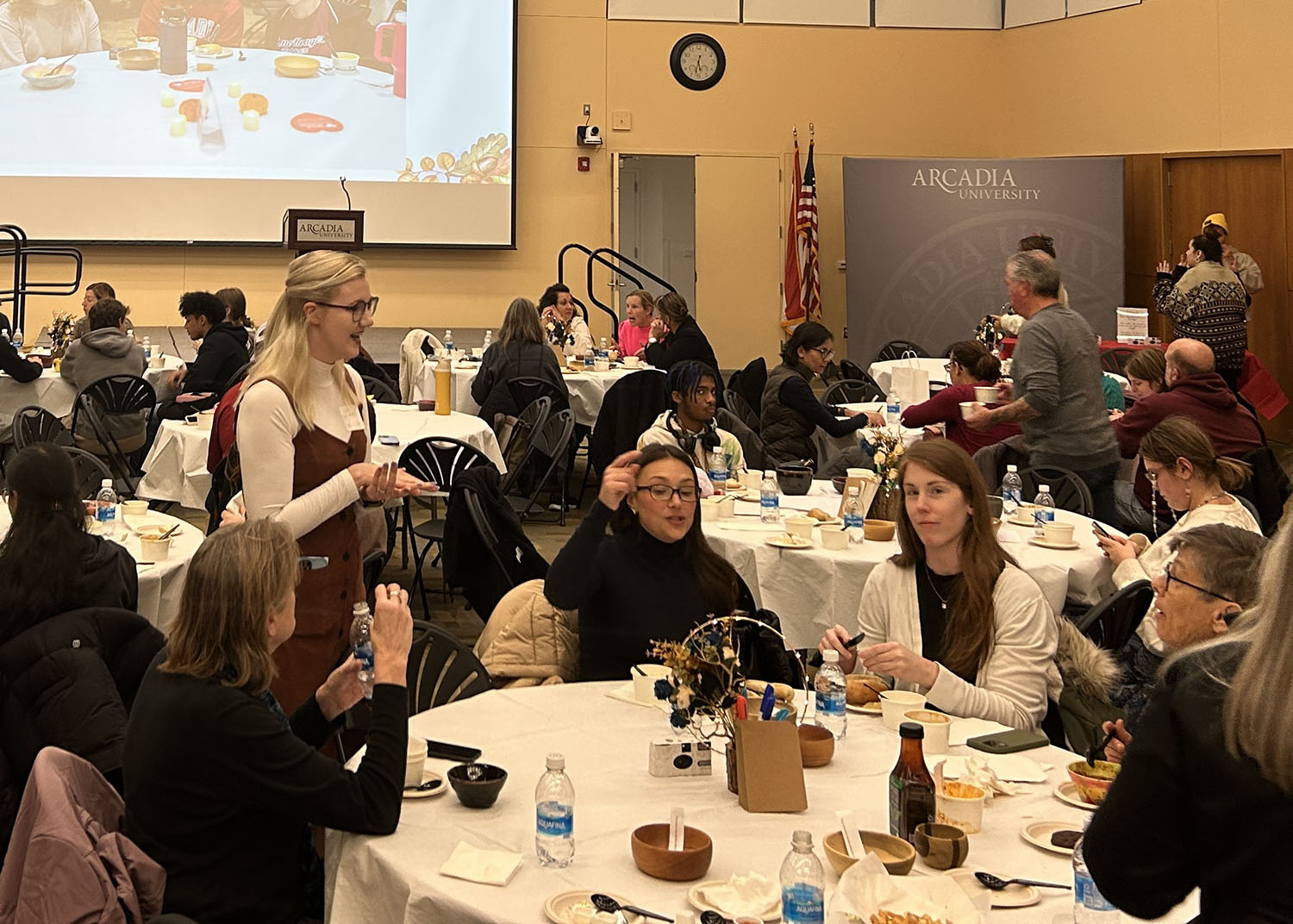 Guests sitting at tables in the Commons Great Room.
