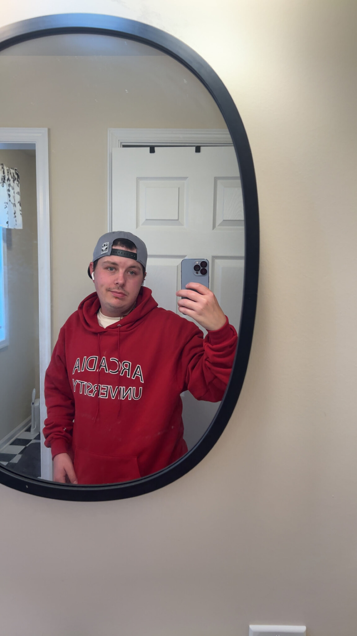 Patrick Poulson ’27 in an Arcadia hoodie.